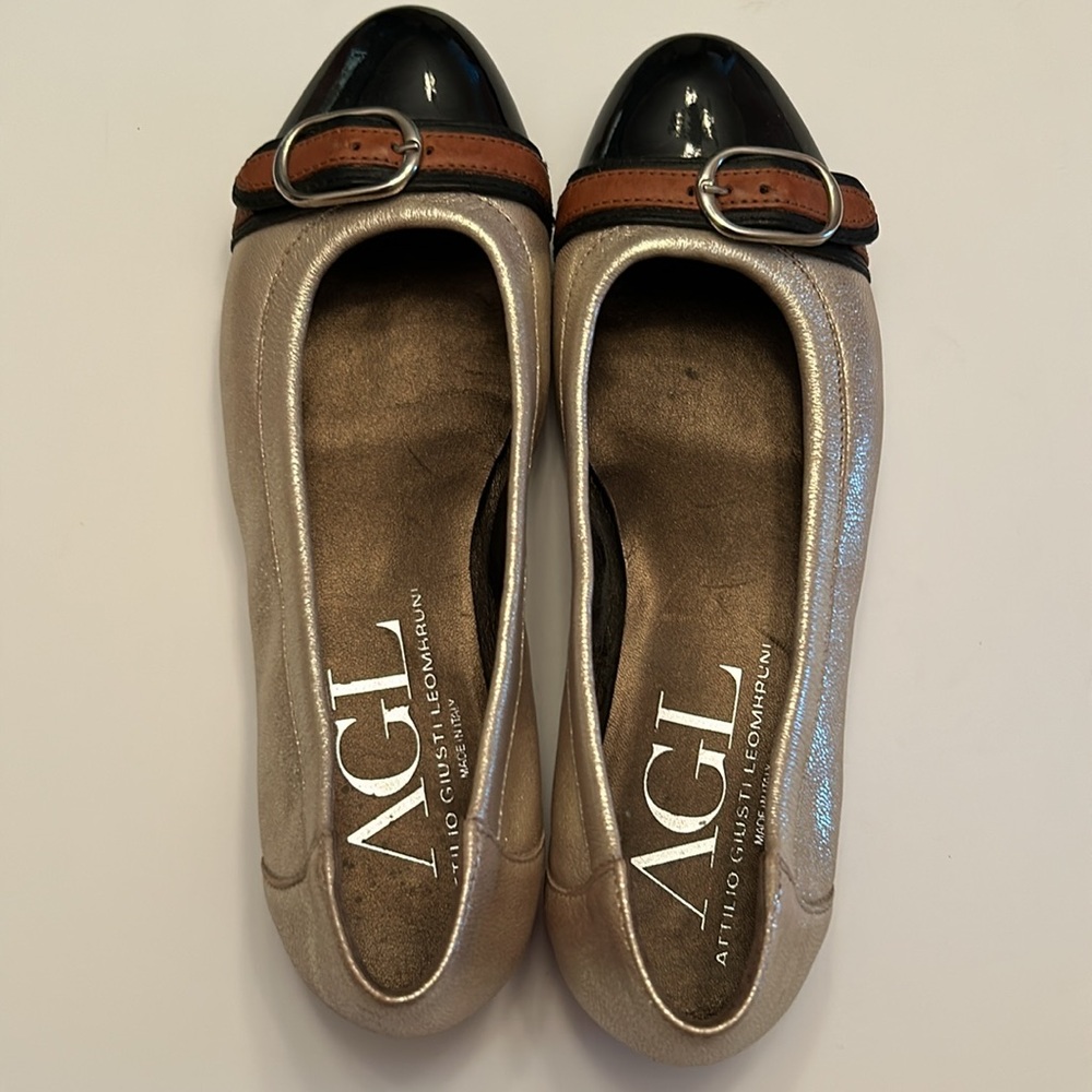 AGL stunning metallic champagne flats with black tips and buckle